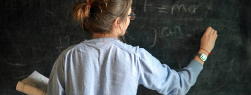 Young Female Student Studying At Blackboard, Education, Back To School, Exam Preparations