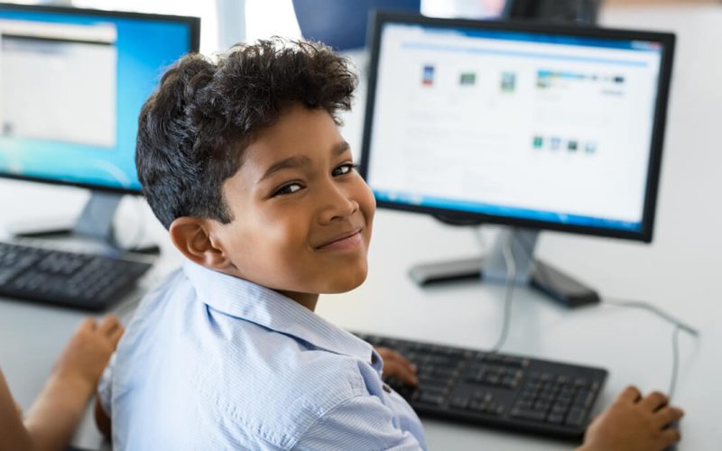 seo-1166-bs-young-happy-schoolboy-using-co-237588382-1200x675